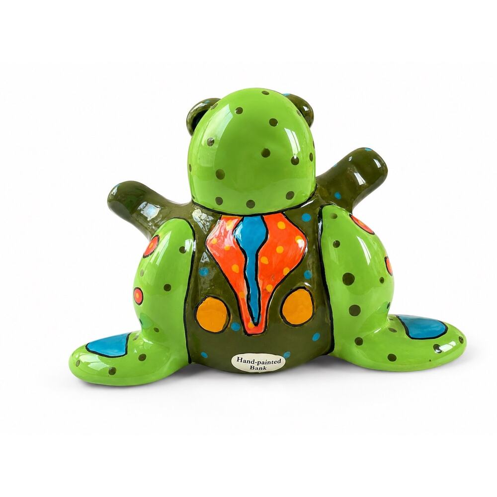 ceramic frog piggy bank is a hand-painted piece signed by Pati Ganz